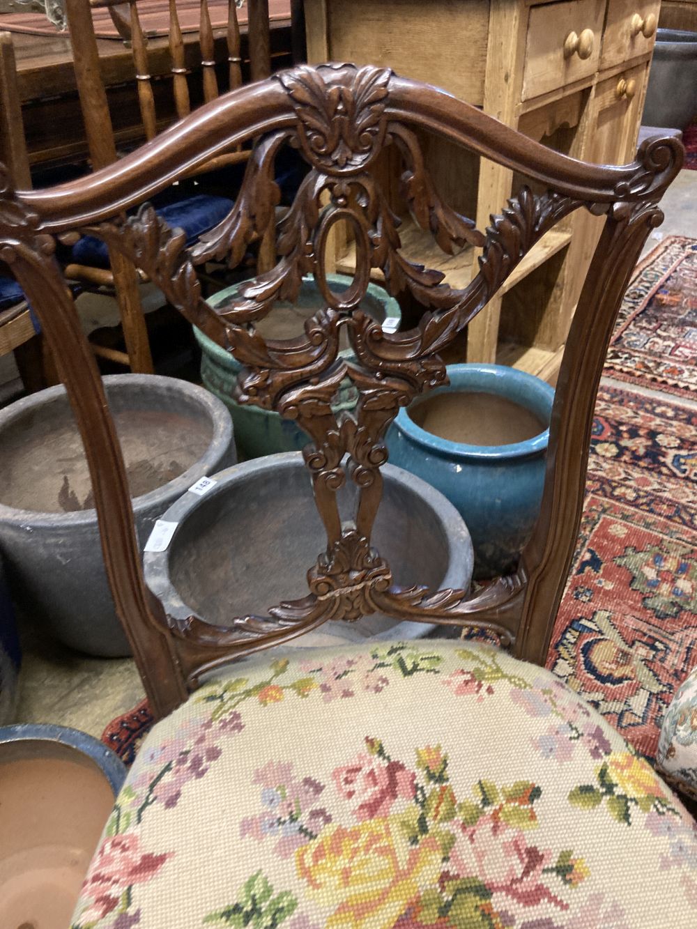 A set of four late Victorian carved oak dining chairs and a pair of Edwardian carved mahogany bedroom chairs (6)